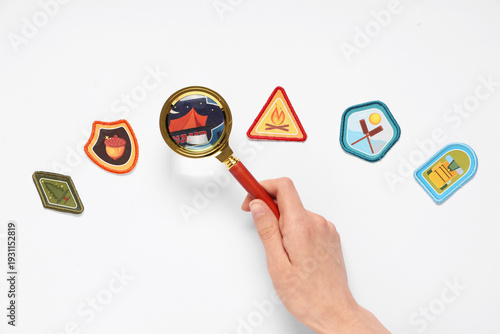 Hand with magnifier and sco...