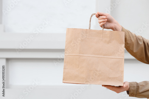 Hands of woman with paper s...