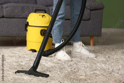 Young woman with modern vac...