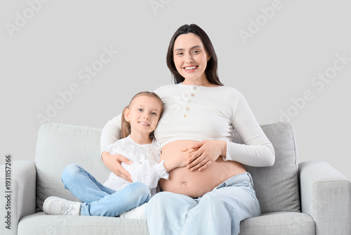 Happy pregnant woman and he...