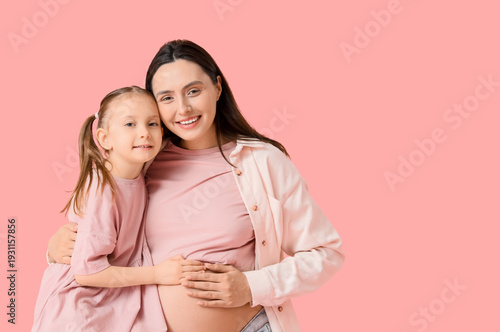 Happy pregnant woman and he...