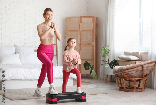 Sporty young mother and her...