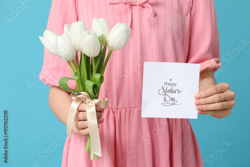 Woman holding card with tex...