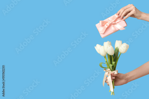 Female hands with bouquet o...