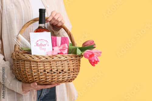 Young woman holding basket ...