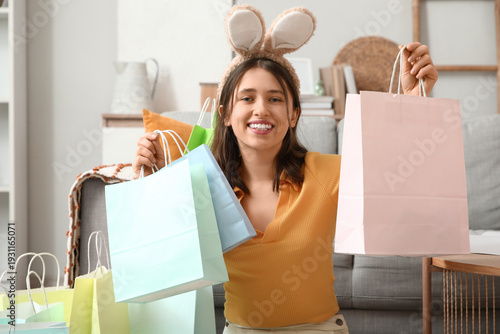 Young woman in bunny ears w...