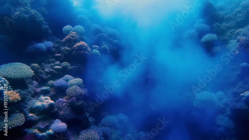 Underwater Coral Reef Ecosystem With Blue Haze And Sunlight Rays.