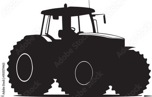 Powerful tractor silhouette showing large wheels and farming machinery.