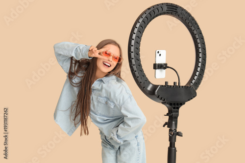 Teenage blogger in sunglass...