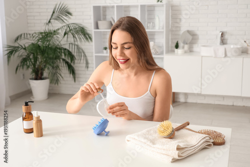Young woman with serum and ...