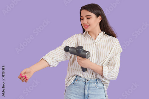 Young woman massaging her a...