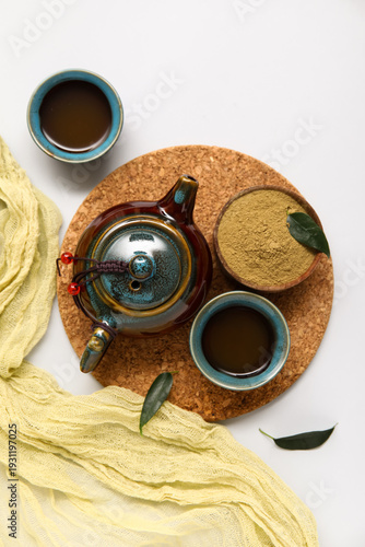 Stand with teapot, cups of ...