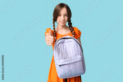 Cute schoolgirl with stylis...