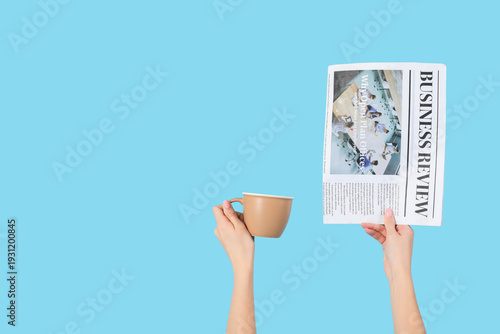 Woman with newspaper and co...