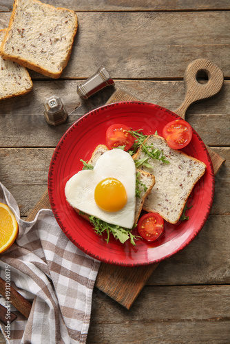 Plate with tasty fried egg,...