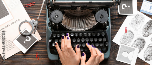 Woman typing on typewriter ...