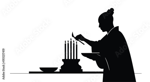 Person in silhouette lighting candles on a stand, a ritualistic or celebratory moment.