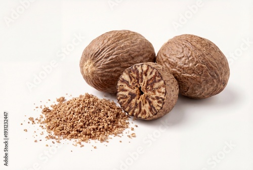 Whole and halved nutmeg with grated powder