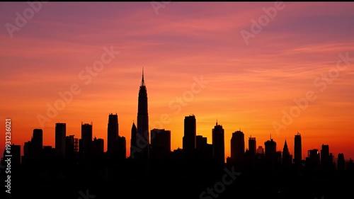 The iconic skyline of new york city during a vibrant sunset