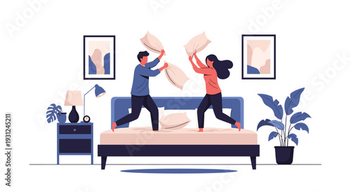 Happy young couple enjoys a playful pillow fight while jumping on their bed in a bright and cozy bedroom during the morning.