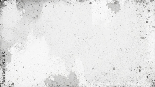 Abstract close-up of a textured, weathered gray wall with white patches.