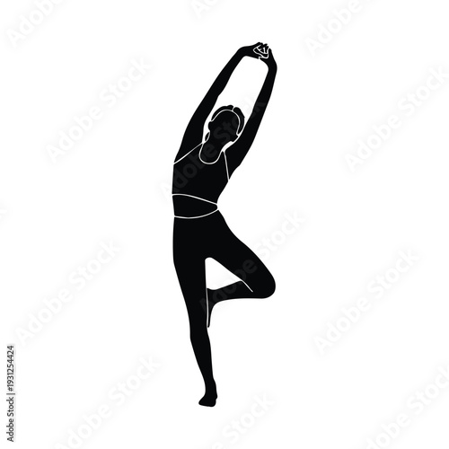 Woman in serene yoga pose standing on one leg with arms raised