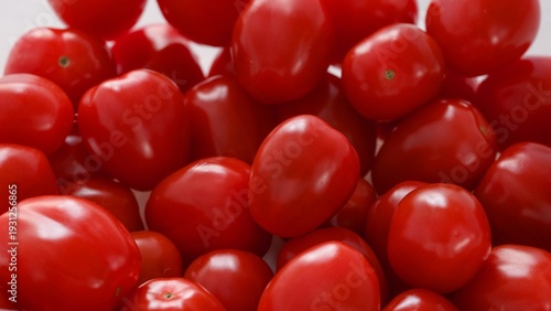 Top view of a pile of fresh red cherry tomatoes.