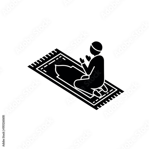 Muslim man praying on a prayer rug.