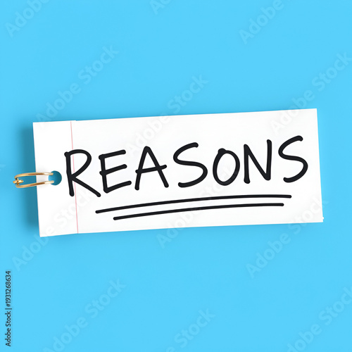 REASONS text written on a notepad on the blue background
