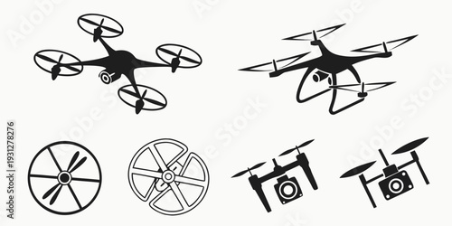 A variety of drones and propellers in a diverse arrangement on a white background.