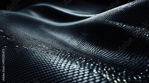 Dark Woven Carbon Fiber Fabric With Subtle Waves And Reflective Highlights image photo