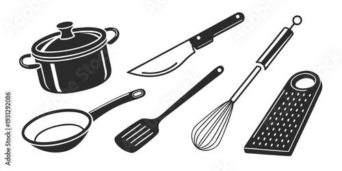 A variety of kitchen utensils and tools laid out on a flat surface