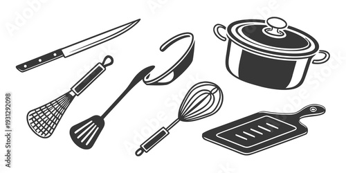 Assorted kitchen utensils and cookware laid out on a flat surface