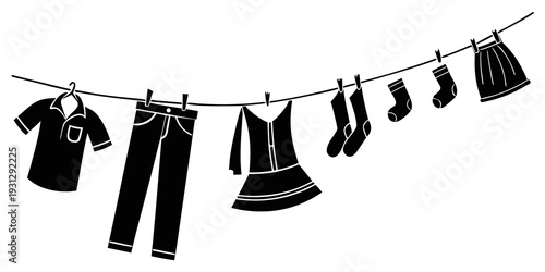A variety of clothing items hanging on a clothesline against a white background.