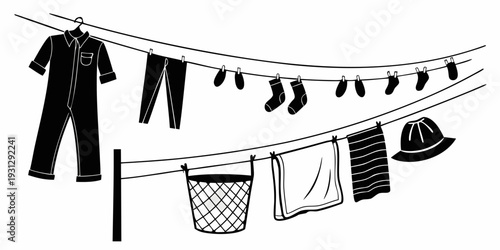 A variety of clothes hanging on a line with a laundry basket underneath