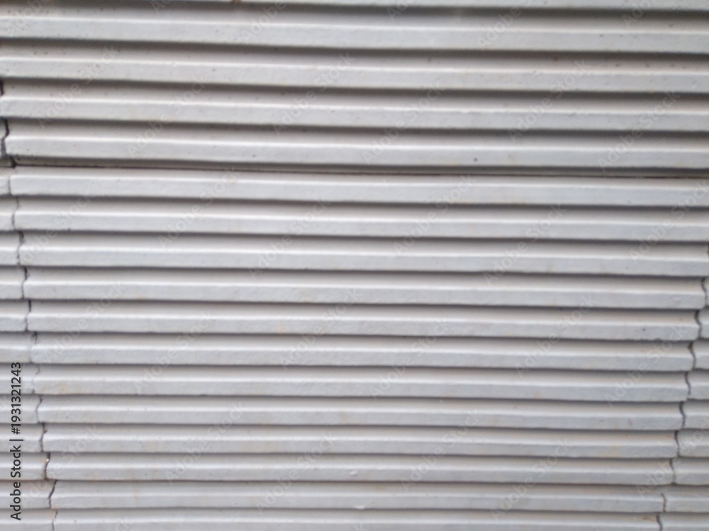 Obraz premium A striped gray cement wall texture. Can be used as a background or wallpaper. The wall surface texture is smooth.