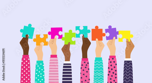 Diverse hands holding puzzle pieces together in unity and cooperation.