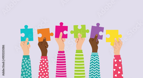 Diverse hands holding colorful puzzle pieces together.