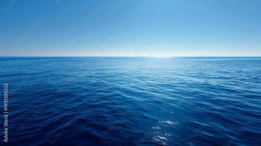 Fototapeta premium The sun shines brightly over a vast expanse of calm and serene ocean water