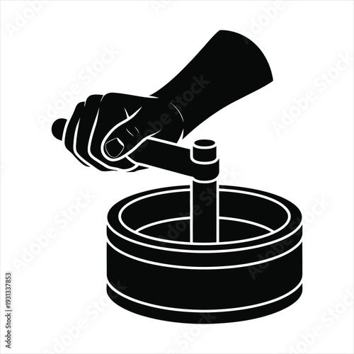 A hand operating an ancient grain grinder, traditional milling tool, grinding flour