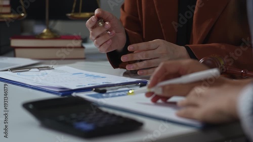 Lawyers and business professionals discuss contract papers at the office. legal and corporate consultation concept focusing on law, advice, and business agreements.