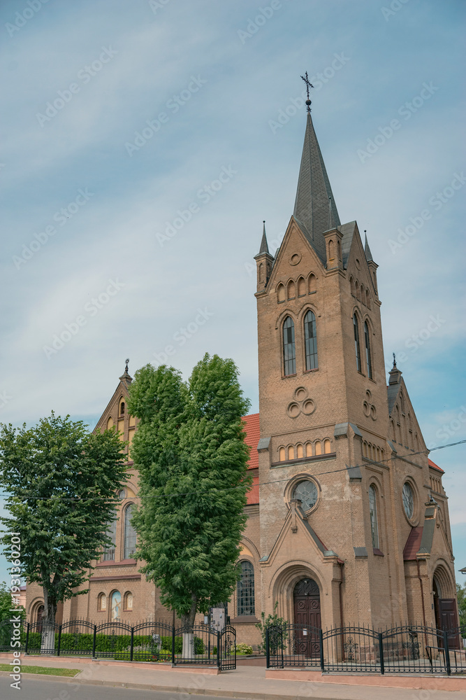 Fototapeta premium Neo-Gothic Holy Cross Exaltation Church in Vileyka with copy space