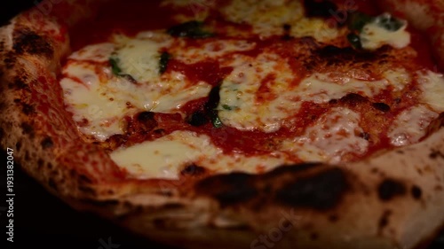 Delicious neapolitan pizza cooking inside a traditional oven