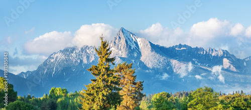 Krivan peak, High Tatras mountains, Slovakia national symbol, snow covered rocky massif, majestic alpine summit, high mountain hiking destination, mountaineering terrain, dramatic winter landscape, ic