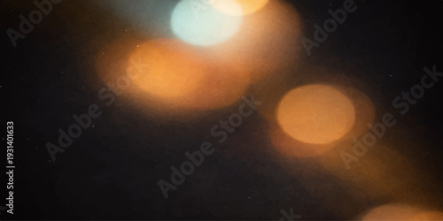 Abstract Light Symphony: An artistic display of blurred, luminous orbs of light dances against a deep, contrasting backdrop, a mesmerizing play of color and form.