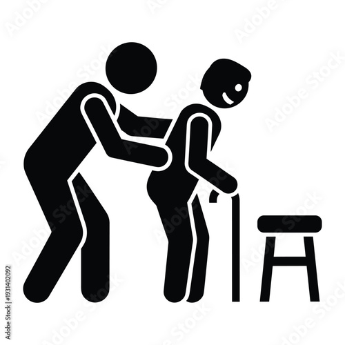 Caregiver assisting elderly man with walking stick towards chair for support and safety in home care setting