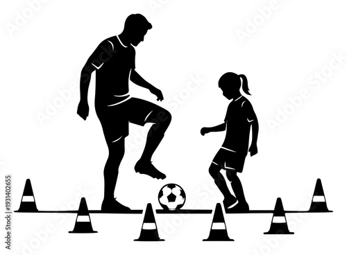 Silhouette of soccer coach and young girl training with ball and cones on the field