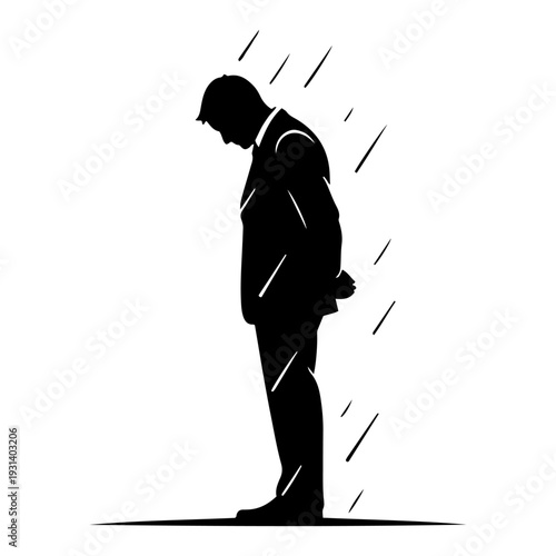 Sad silhouette of a man standing in the rain with head bowed after defeat