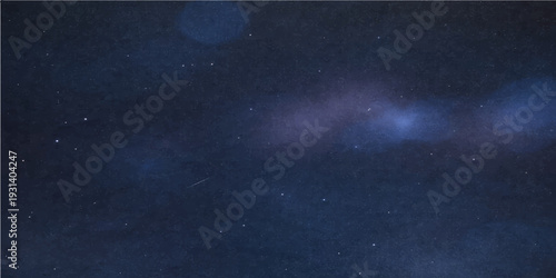 Cosmic Canvas: A deep, dark expanse of the night sky, speckled with countless stars, creating a celestial panorama. 