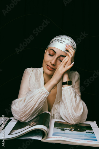 Portrait of a bald young woman with natural beauty and confident expression, isolated on neutral background. Concept of individuality, strength, self-acceptance, awareness, alopecia,